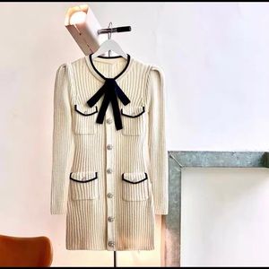 Cream knit dress with bow tie